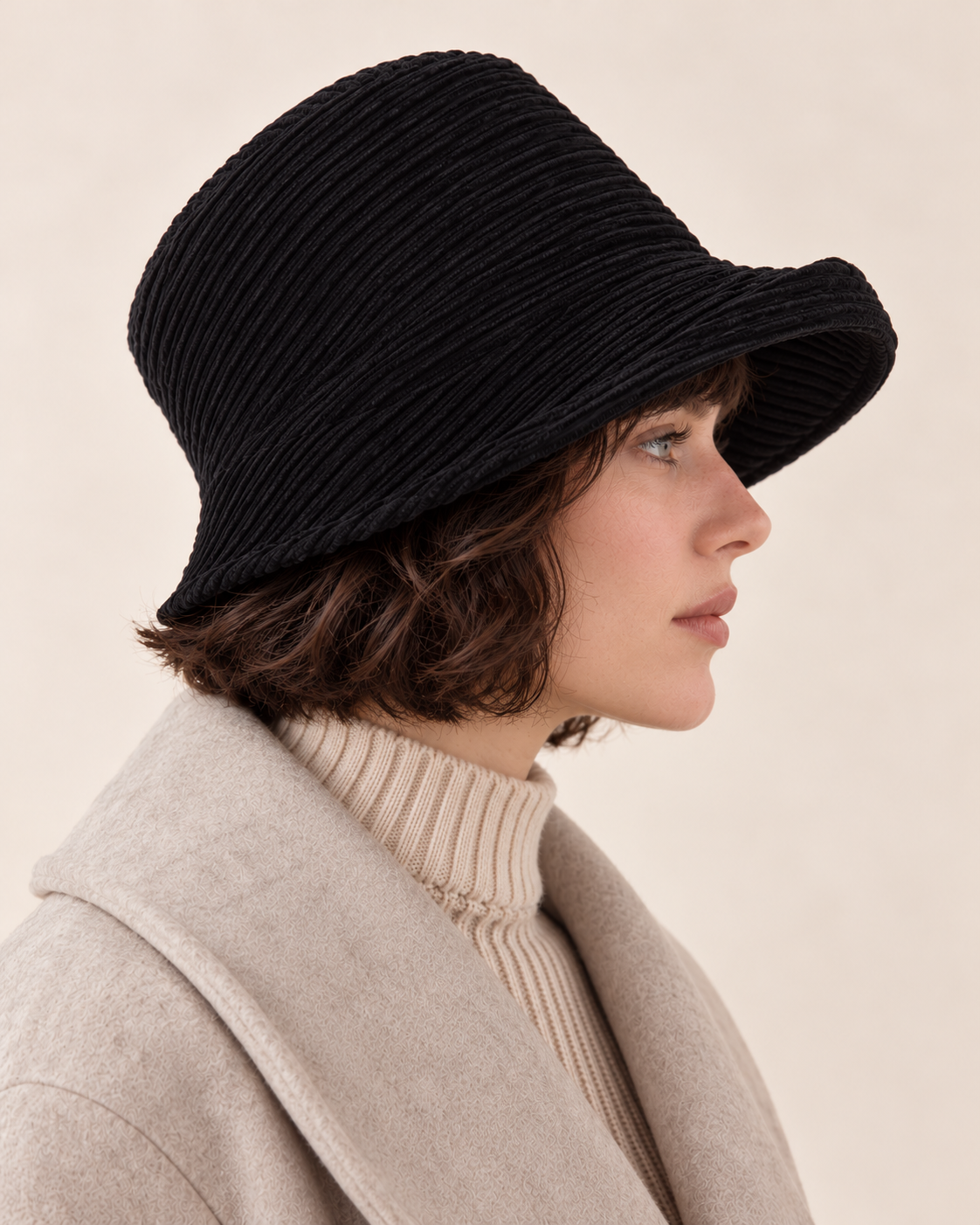 Black side profile model view — corduroy asymmetric brim bucket hat, no metal badge