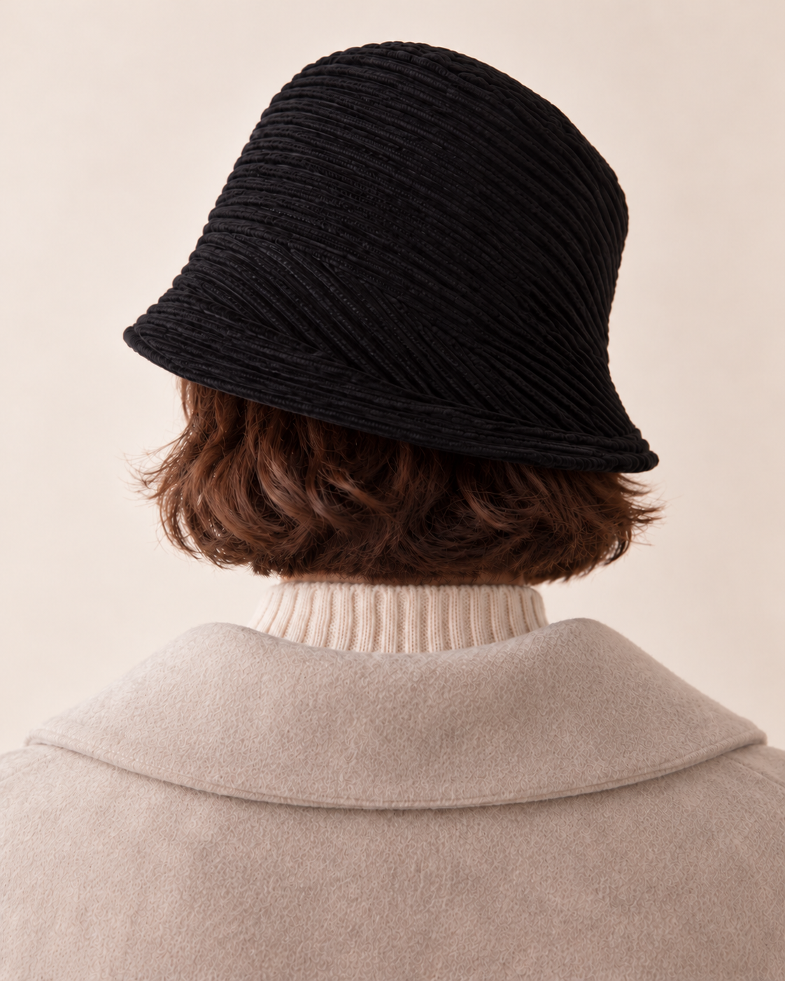 Black rear model view — corduroy asymmetric brim bucket hat, no metal badge