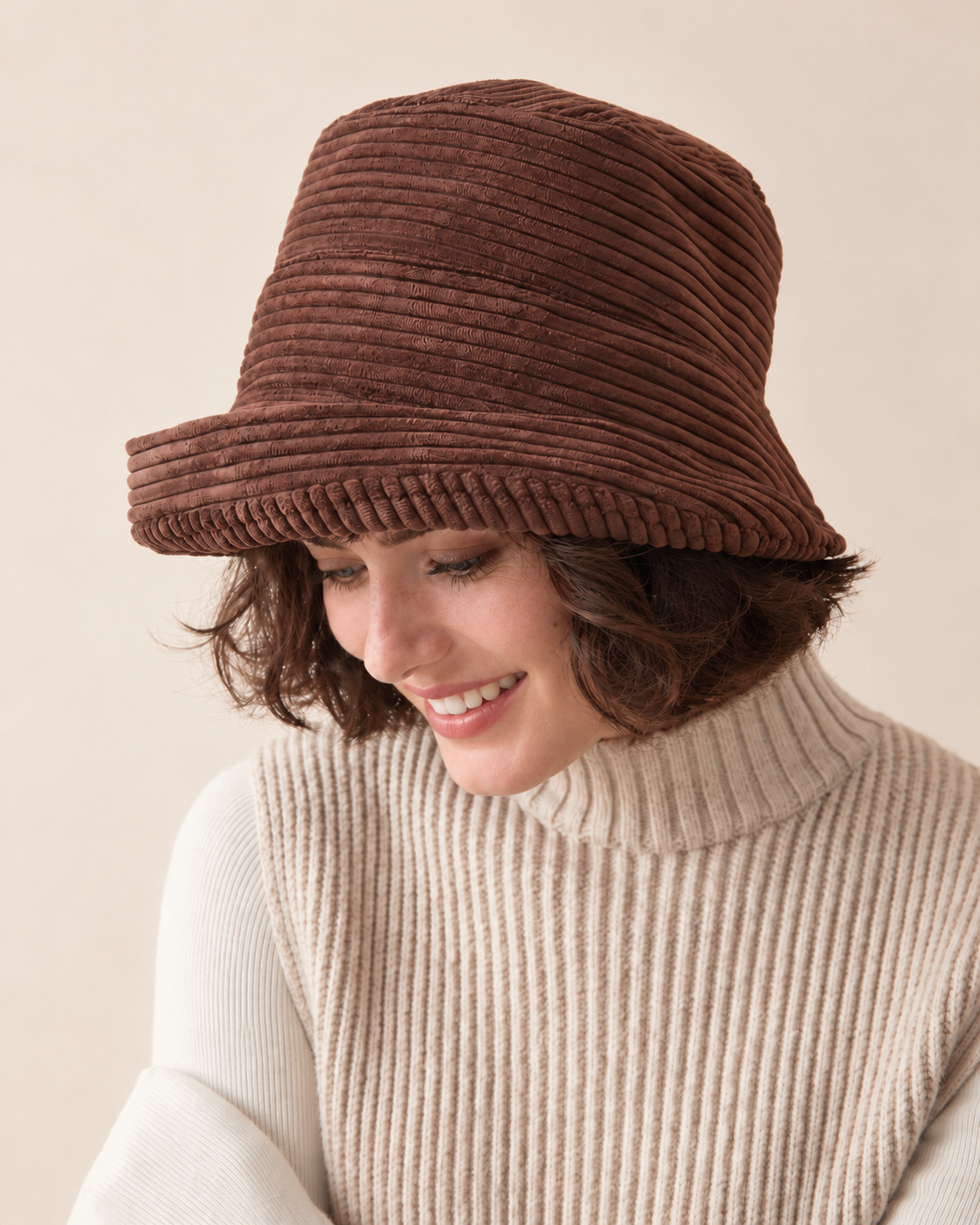 brown corduroy asymmetric brim bucket hat without metal badge on short-haired female model