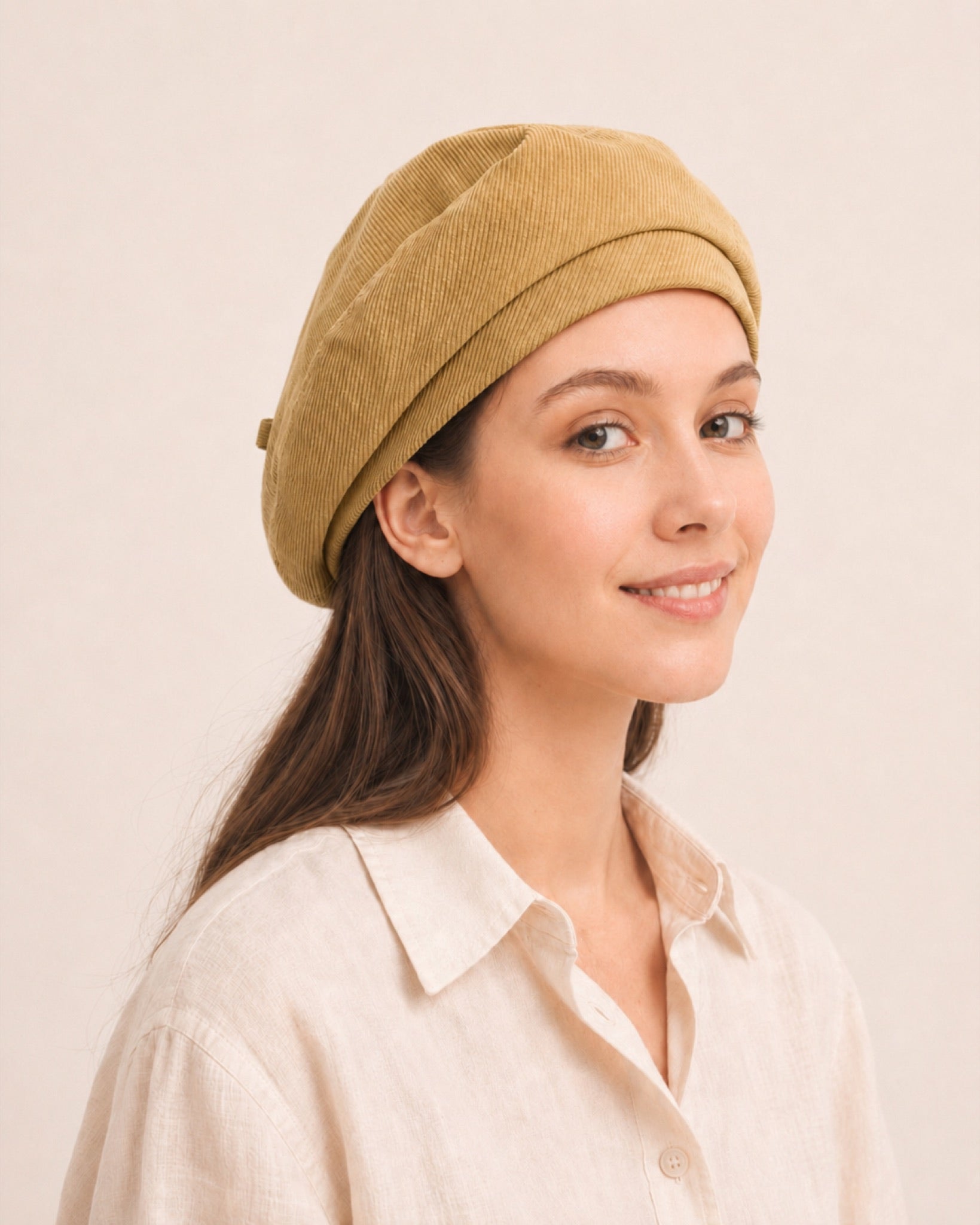 Woman wearing yellow cotton linen French beret