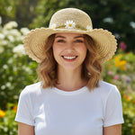 Woman Wearing Daisy Straw Sun Hat - Front View - Wide Brim Beach Hat in Outdoor Garden Setting