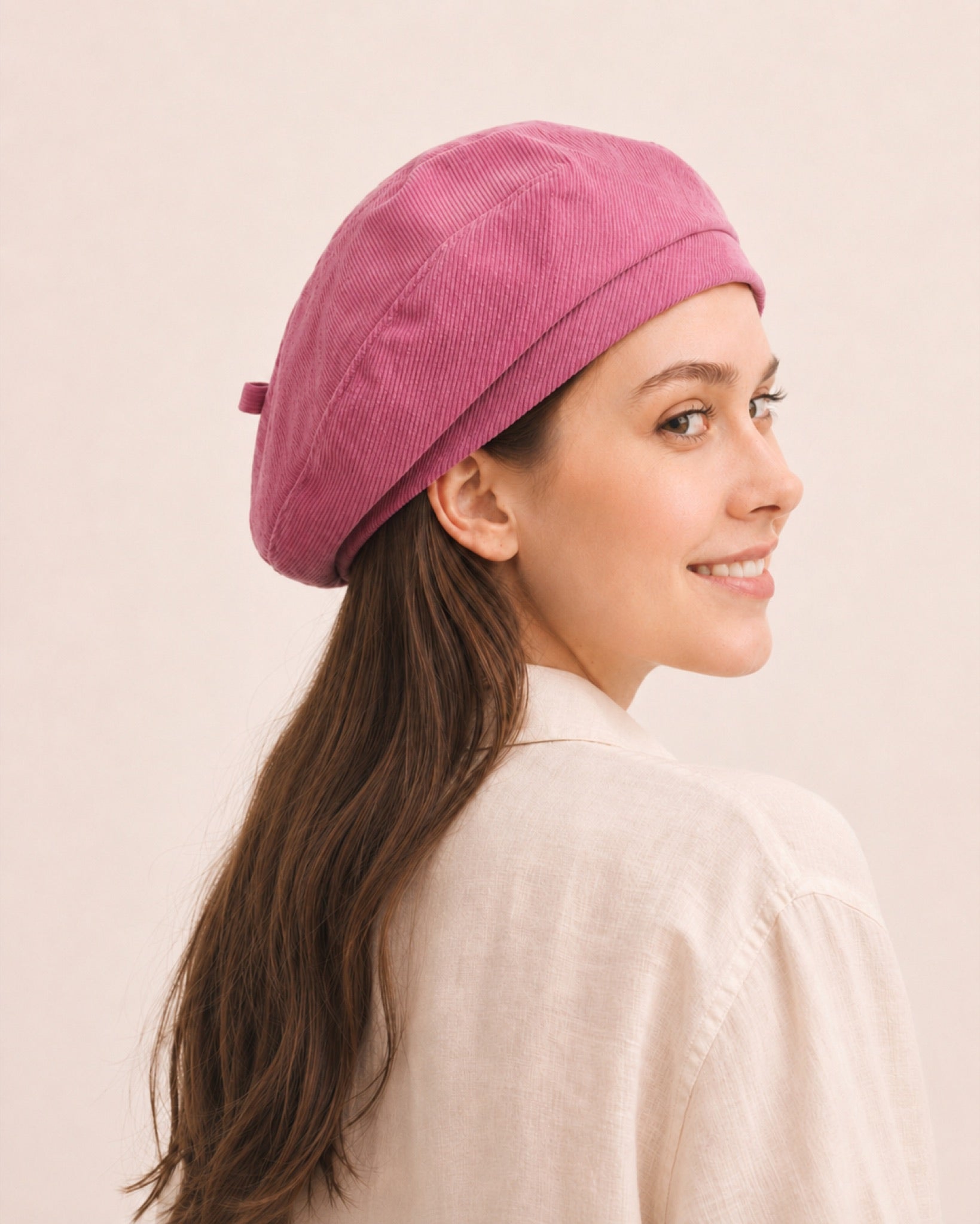 Woman wearing pink cotton linen French beret