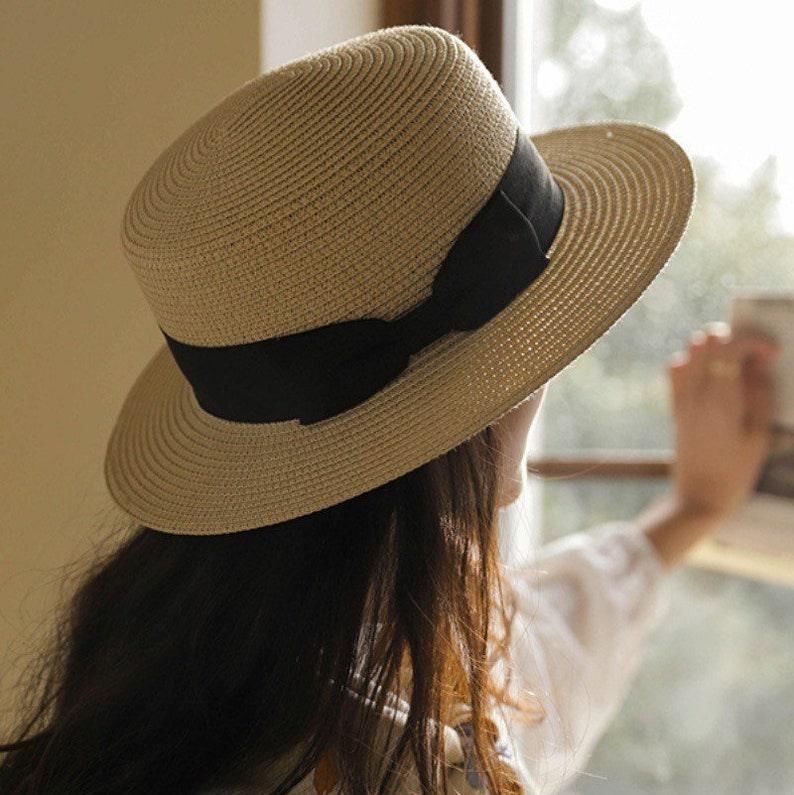 Classic Straw Boater Hat - Model Wearing Khaki with Black Ribbon