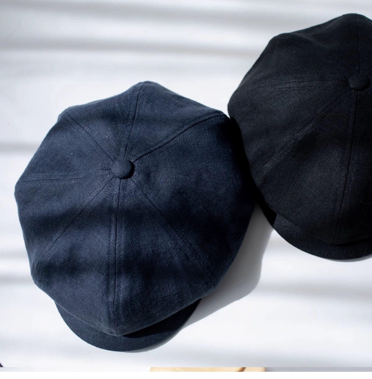 Black and Navy Linen Newsboy Caps Flat Lay - Mspineapplecrafts