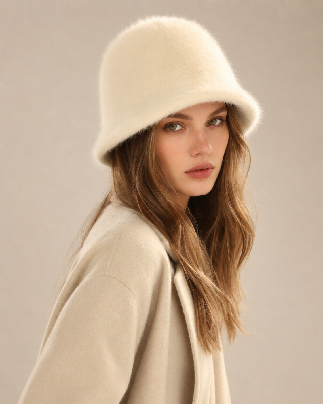 Ivory cream rabbit-hair blend bucket hat on a woman, angled front view