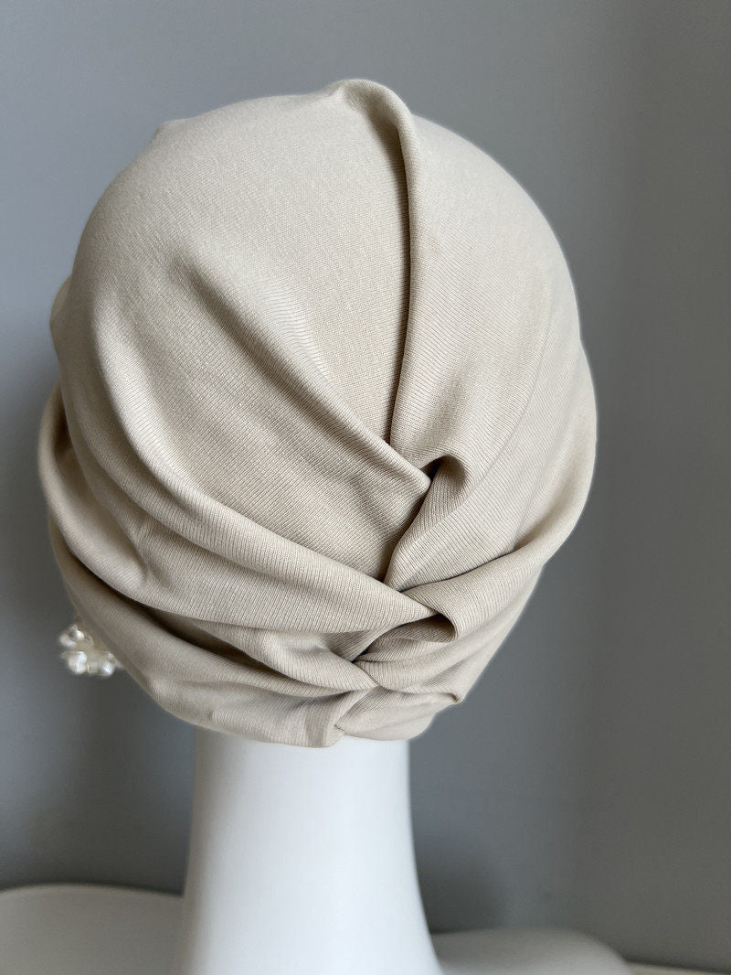 Back view of a khaki modal cotton turban hair wrap