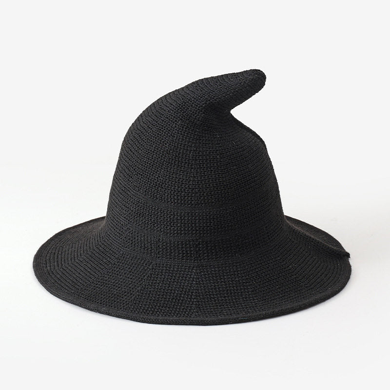 Black knitted witch hat for kids on a white background