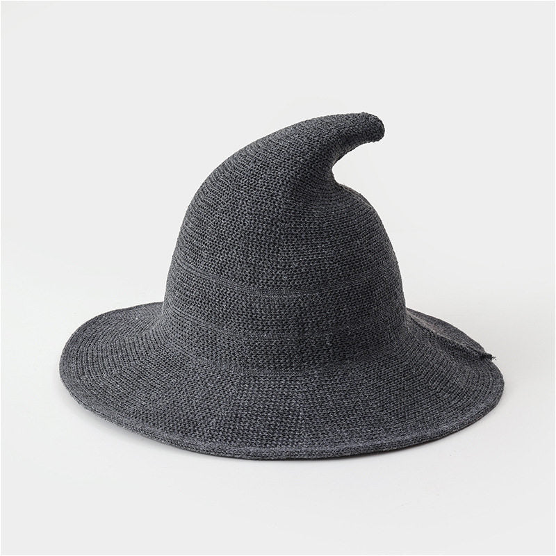 Dark gray knitted witch hat for kids on a white background