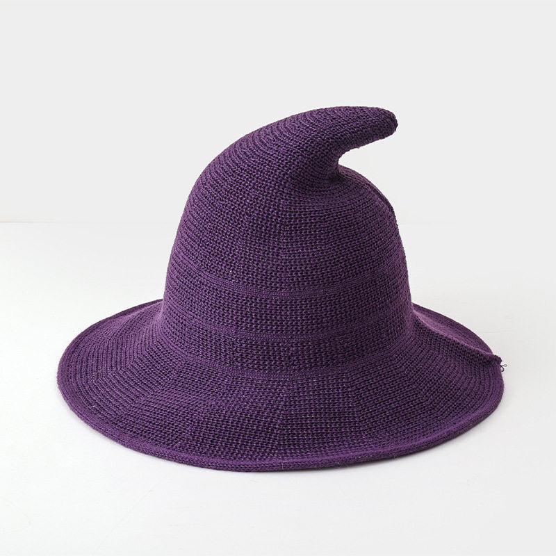 Deep purple knitted witch hat for kids on a white background