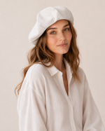 Woman wearing oversized linen French beret – Black & White Stripe
