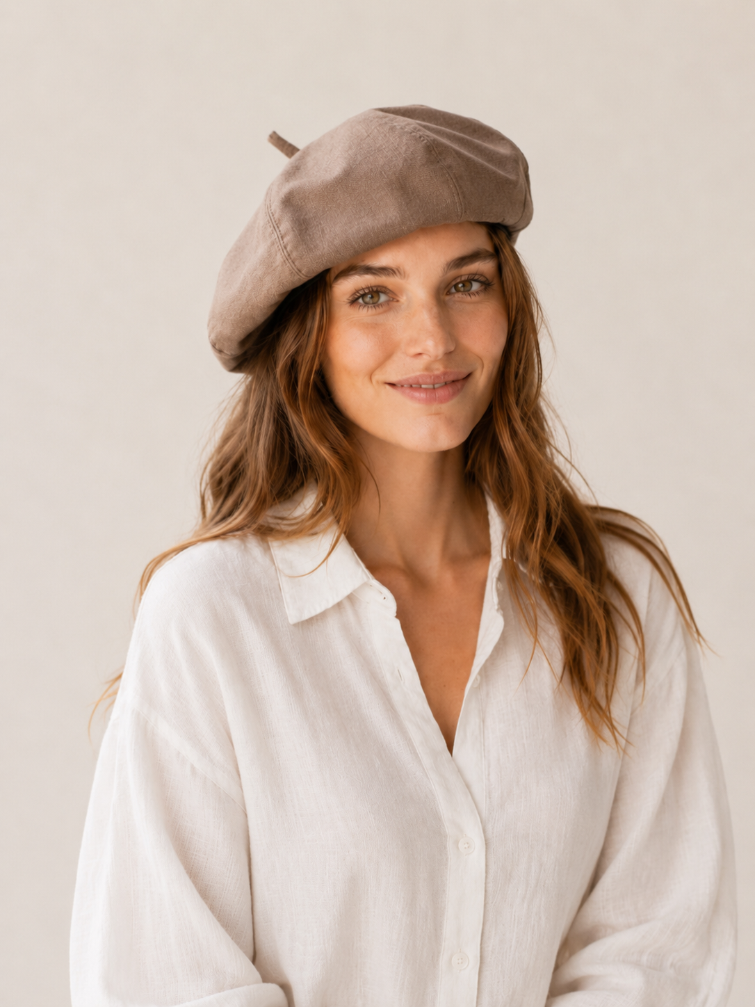 Woman wearing oversized linen French beret – Brown