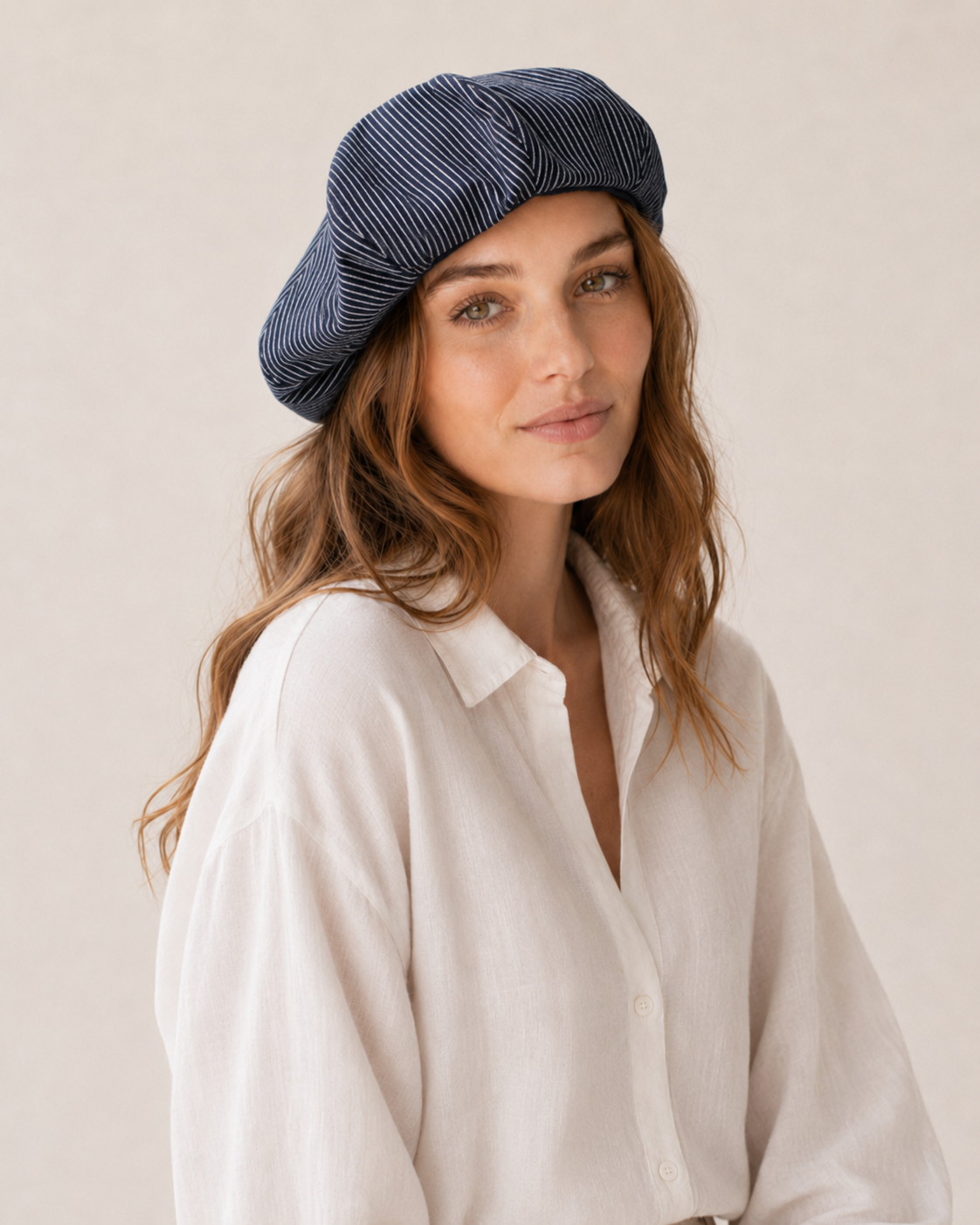 Woman wearing oversized linen French beret – Navy Stripe
