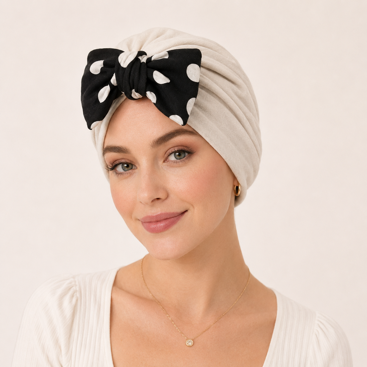 Woman wearing a soft modal cotton polka dot bow turban hair wrap