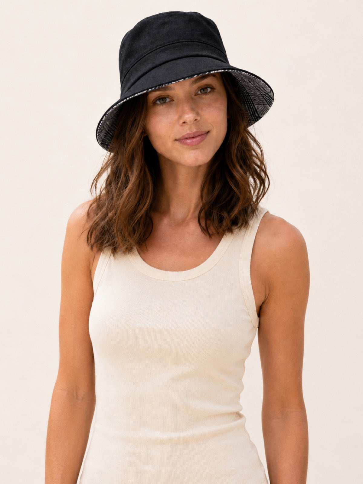 Reversible Linen Bucket Hat for Women – Black, worn by model, 2-in-1 reversible sun hat