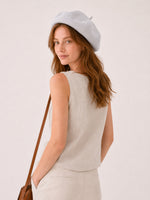 Woman wearing gray linen beret