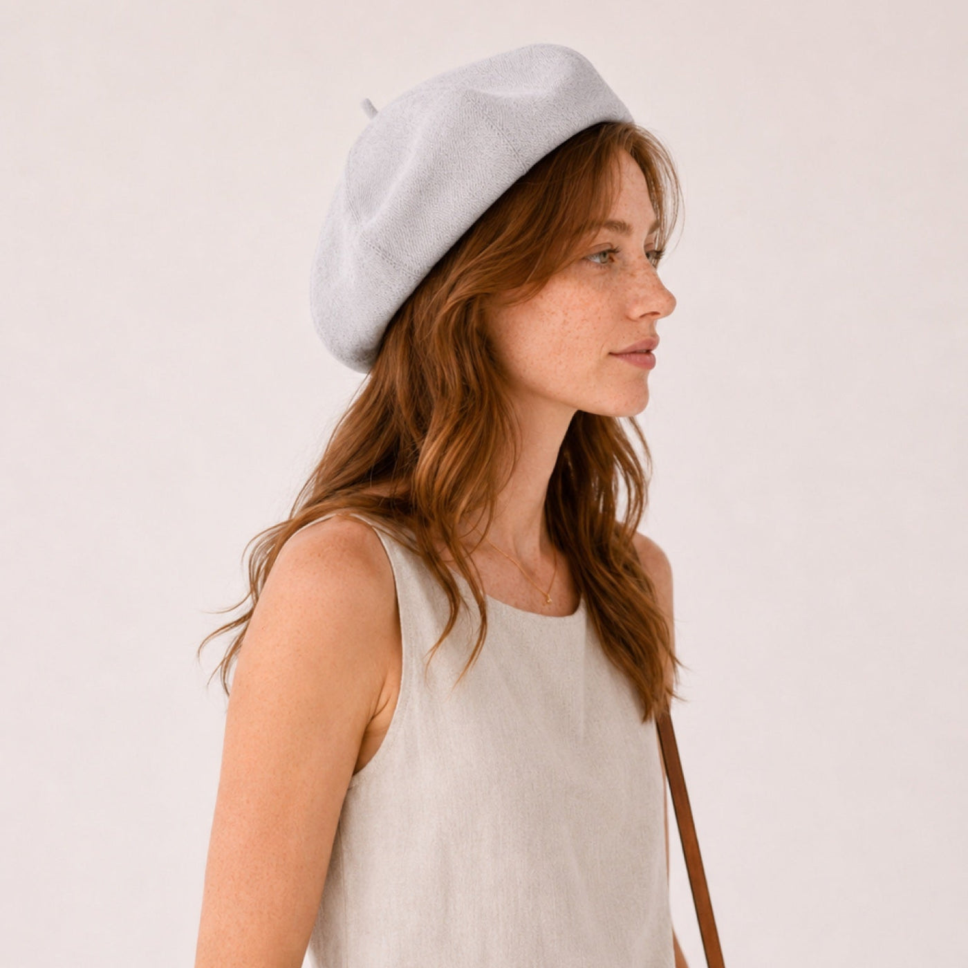 Woman wearing gray linen beret