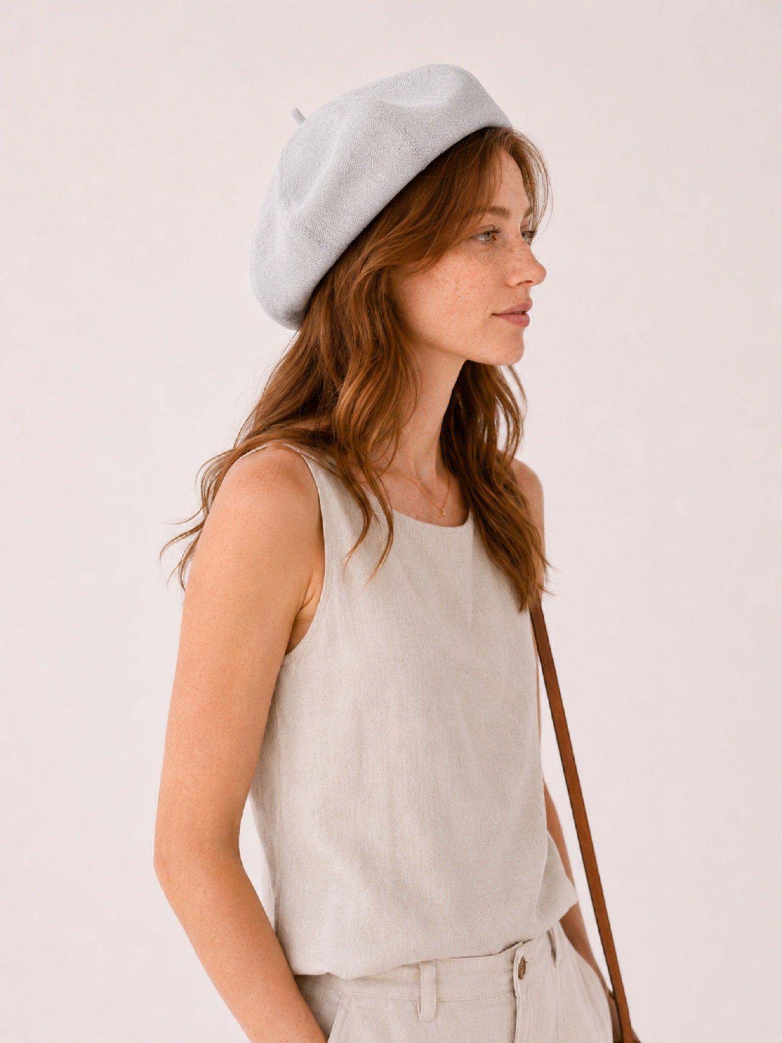 Woman wearing gray linen beret