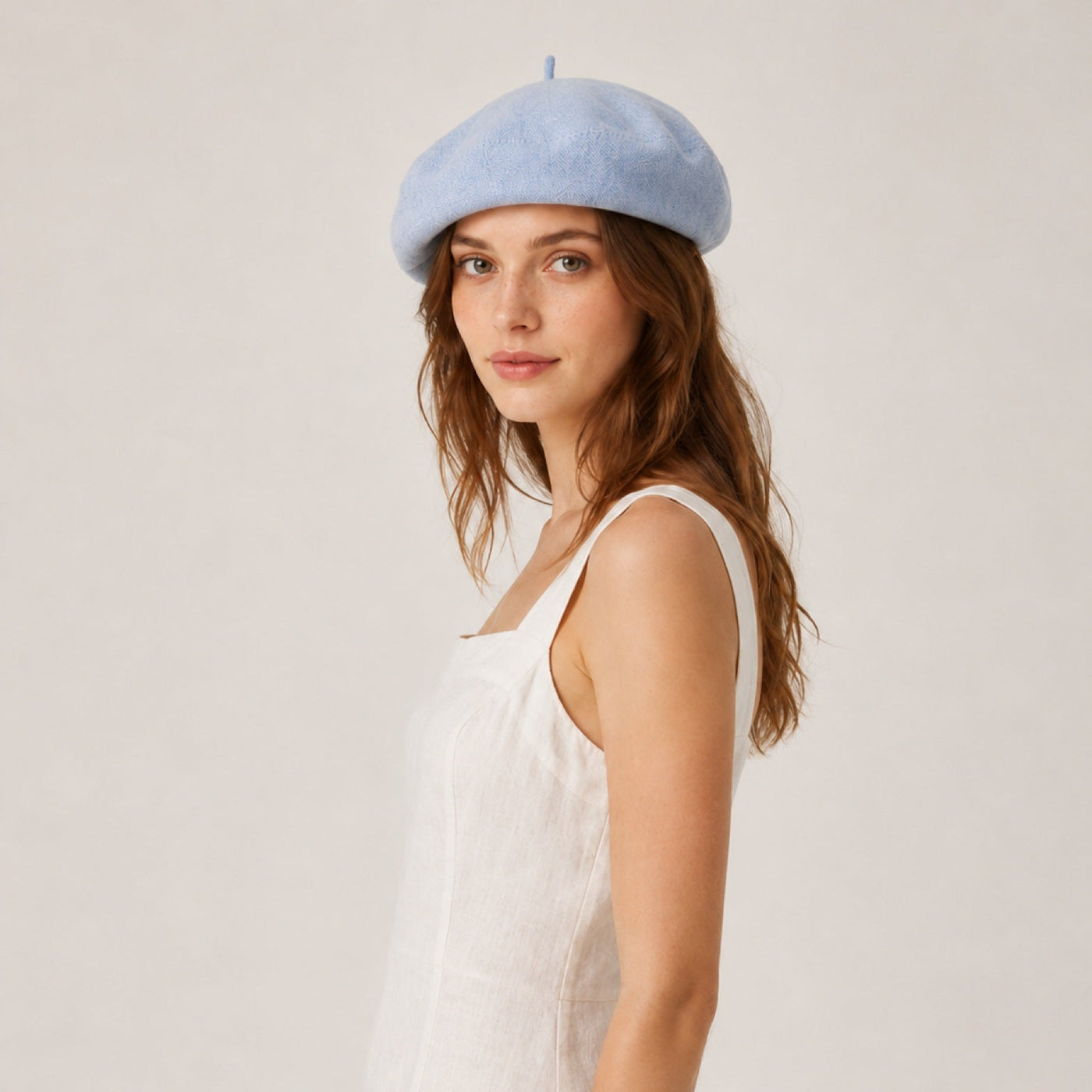 Woman wearing mustard linen beret
