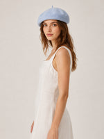 Woman wearing oversized linen French beret – Mustard