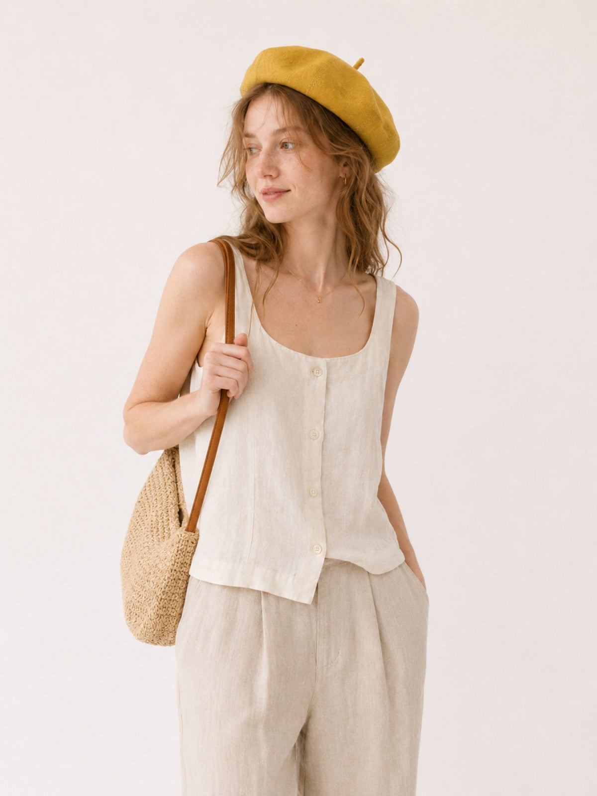 Woman wearing oversized linen French beret – Mustard