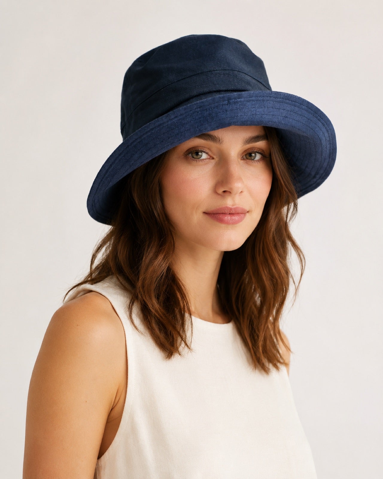 Reversible Linen Bucket Hat for Women – Navy, worn by model, 2-in-1 reversible sun hat