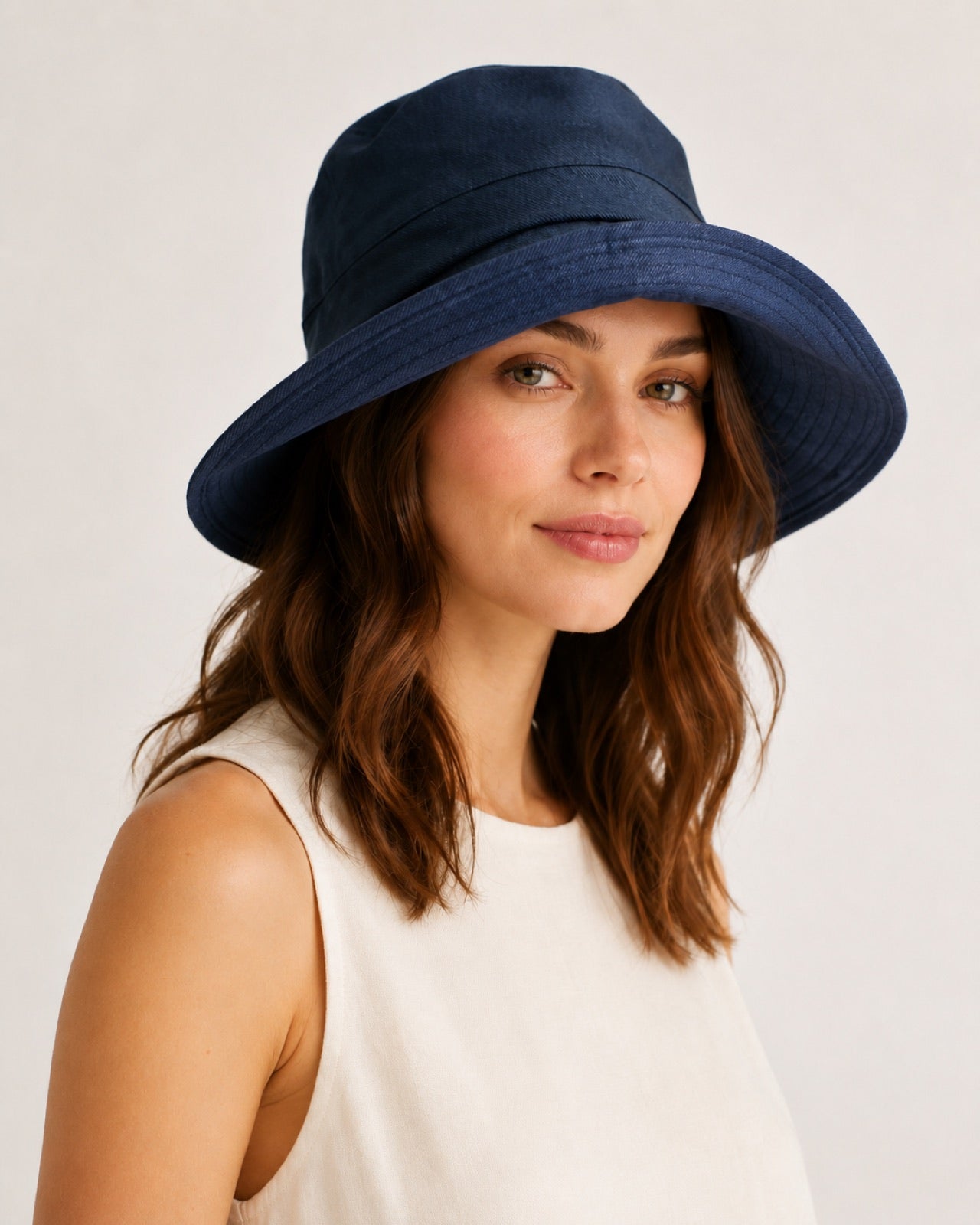 Reversible Linen Bucket Hat for Women – Navy, worn by model, 2-in-1 reversible sun hat