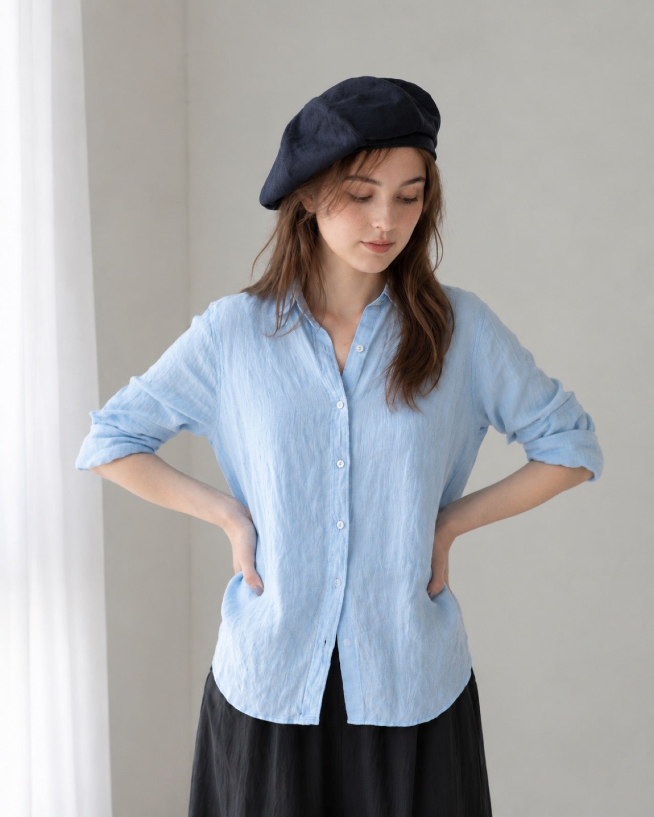Navy linen beret model front view with light blue linen shirt