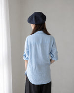 Navy linen beret model front view hands on hips