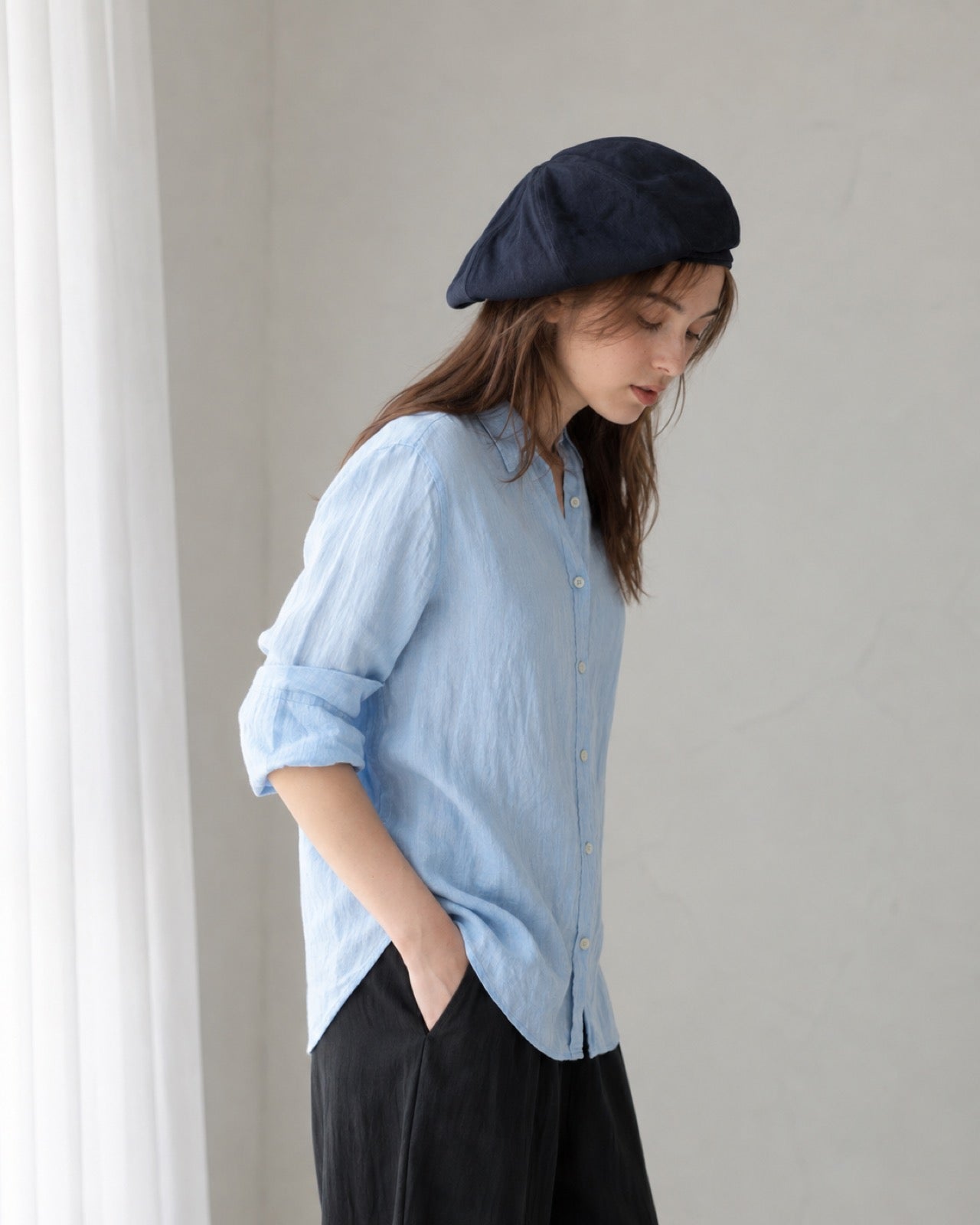 Navy linen beret model side view