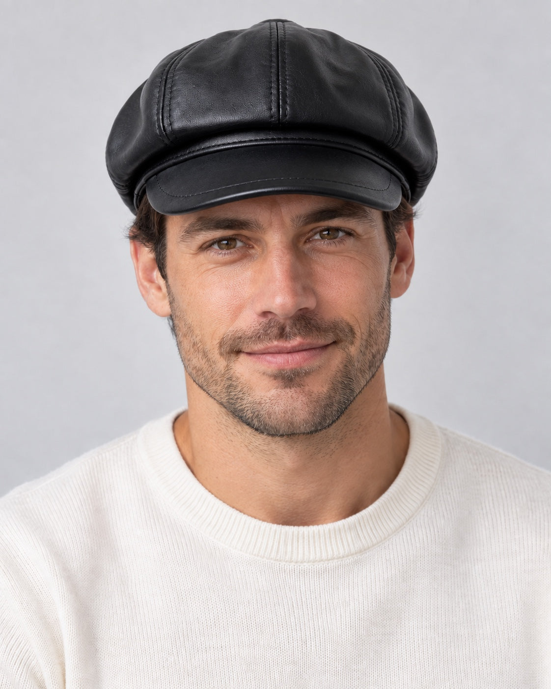 Man wearing the black genuine leather short-brim newsboy cap, front view