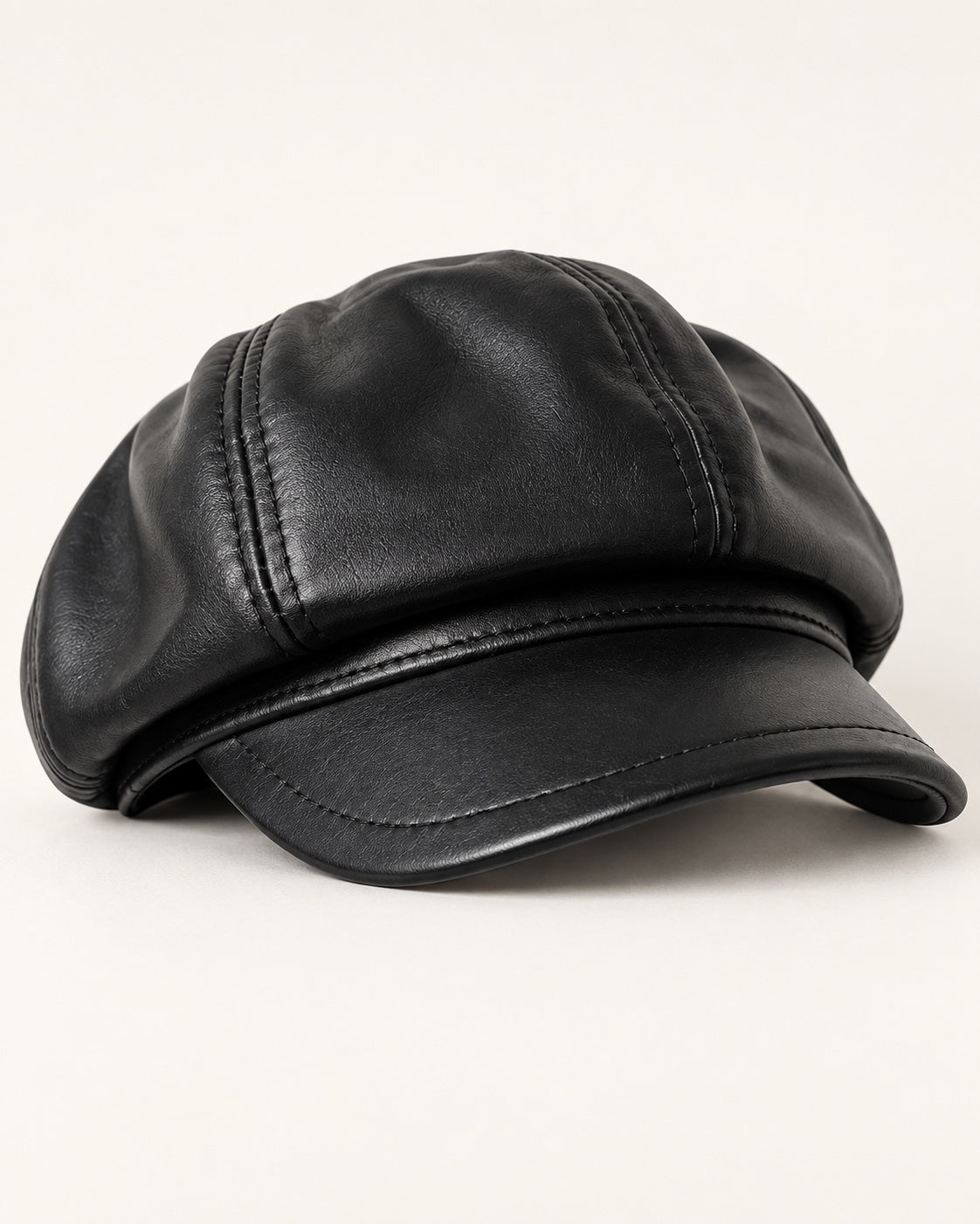 Black genuine leather short-brim newsboy cap, front three-quarter product view