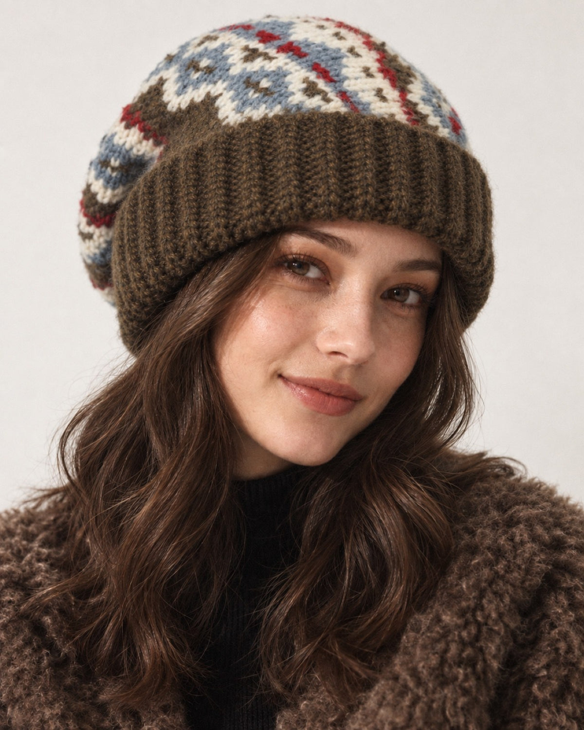 Young woman wearing the Olive Brown Fair Isle oversized slouchy beanie, front studio portrait