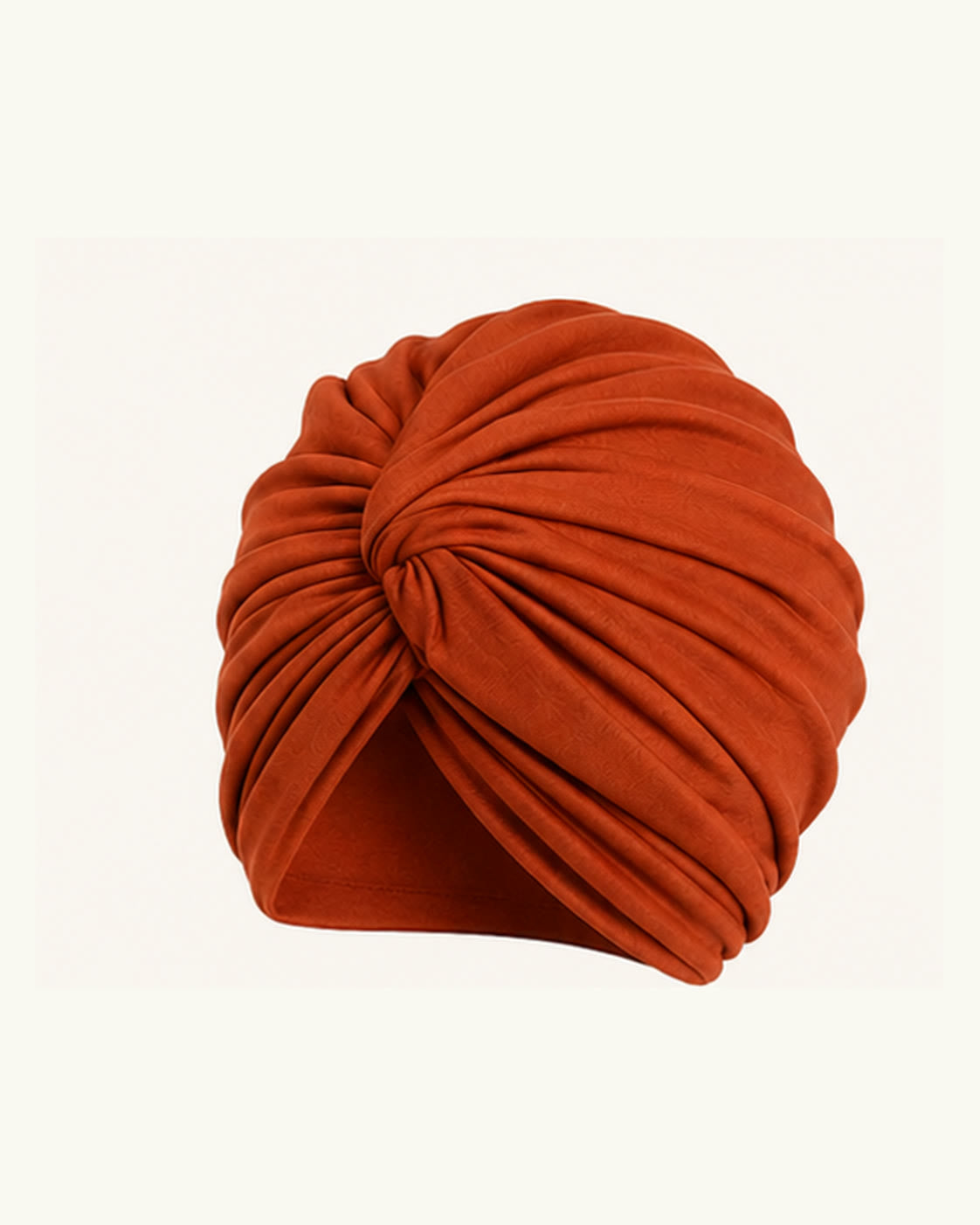 Orange modal cotton knot turban head wrap on an off-white background