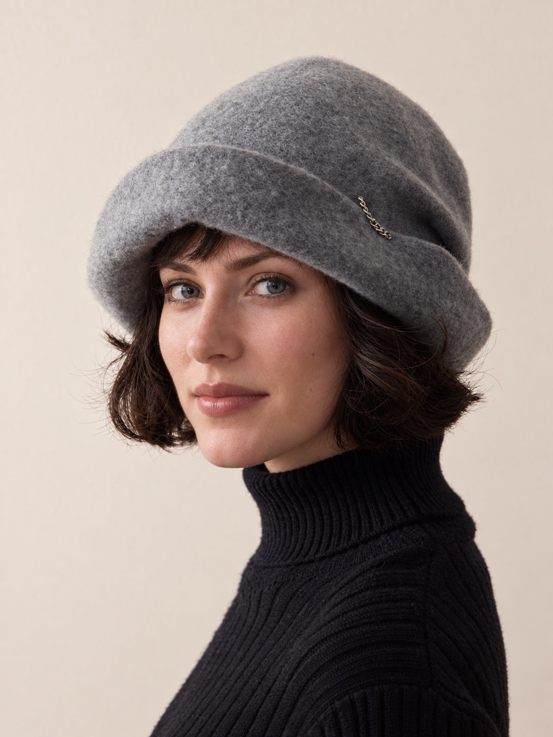 White female model wearing the Smoke Grey wool slouchy beret in a front studio view