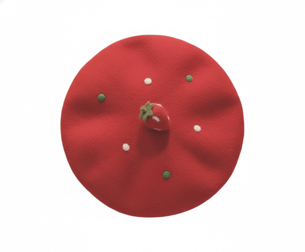 Strawberry wool beret flat lay on white background showing full shape and decoration