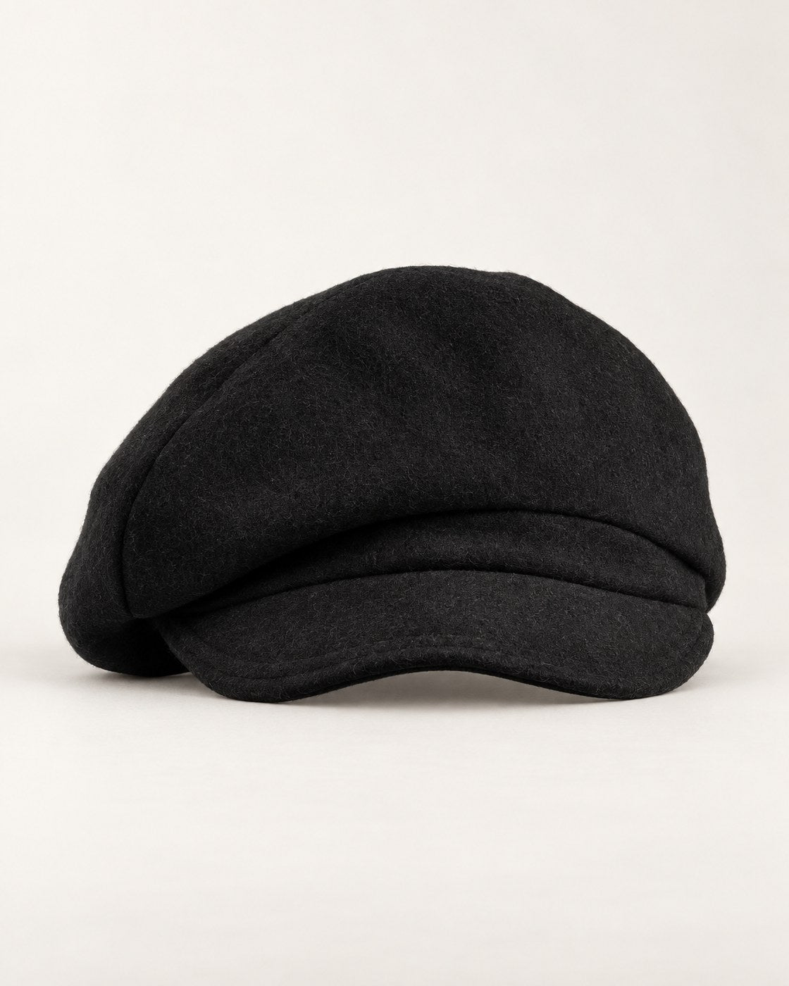 Black 100% wool 5-way cap, product-only front view on a clean light background