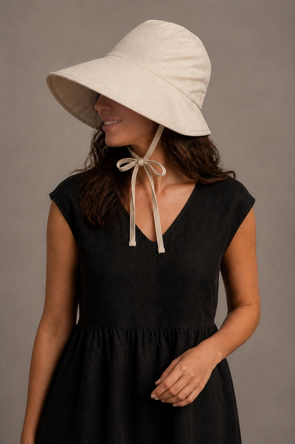 Opposite three-quarter view showing the hat's crown seams and wide brim