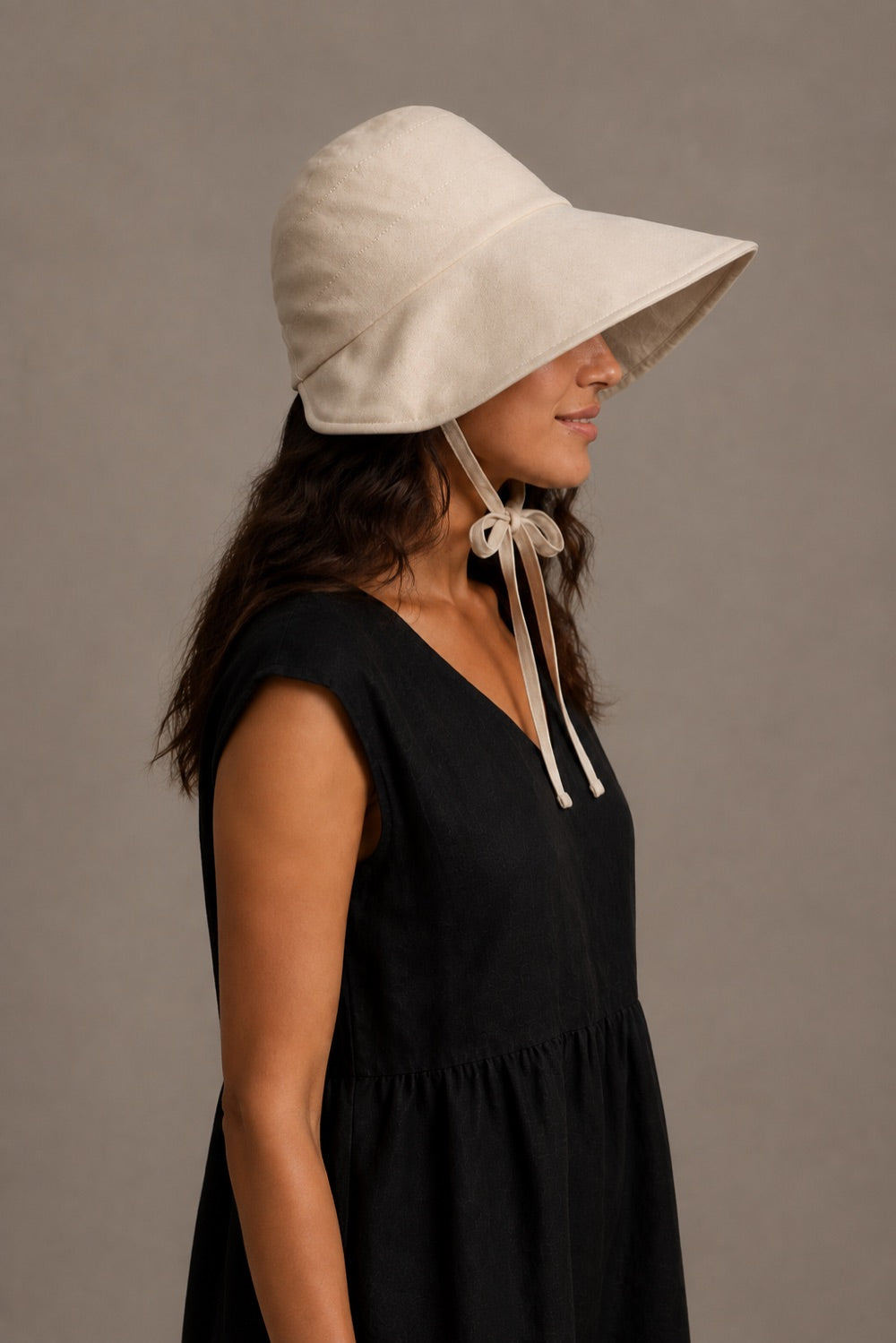 Right profile showing the Breathable Summer Bucket Hat's directional brim and tied fit