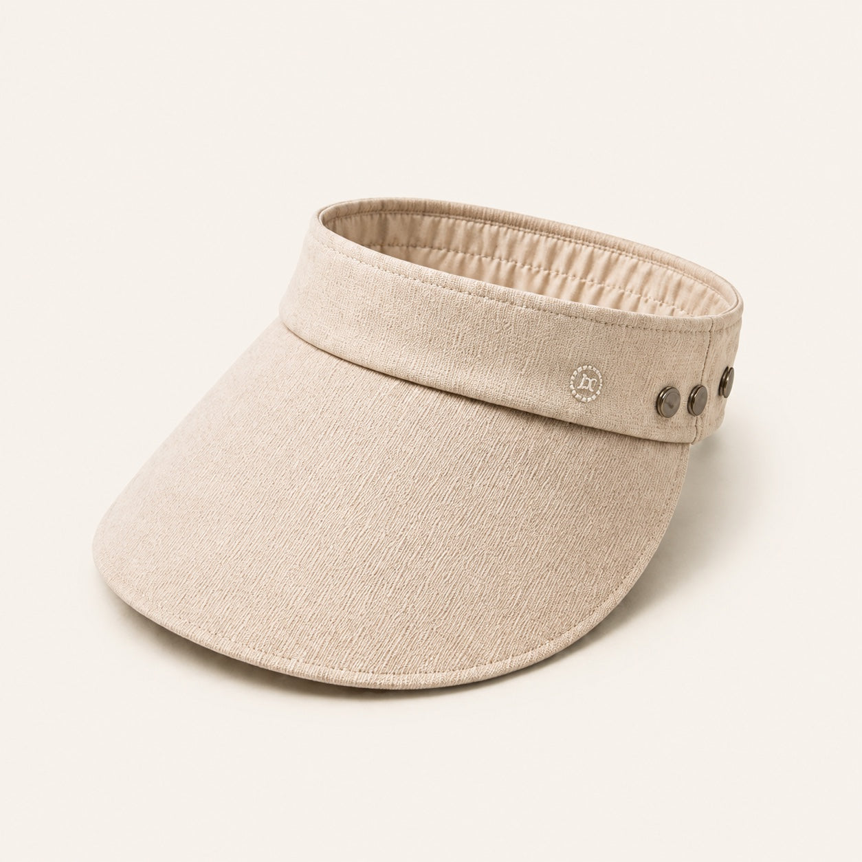 Beige wide brim sun visor with the removable crown detached