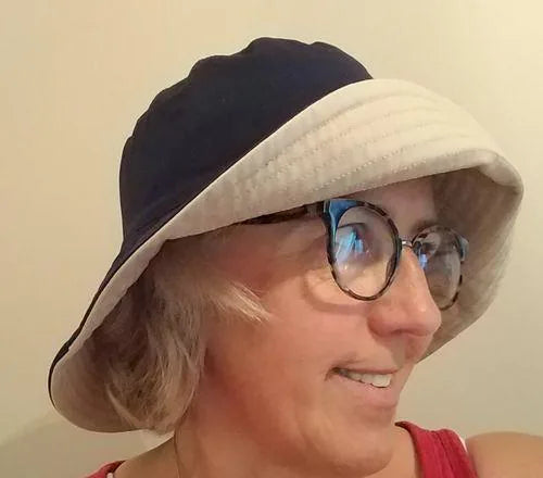 Ally wearing a reversible wide-brim bucket hat